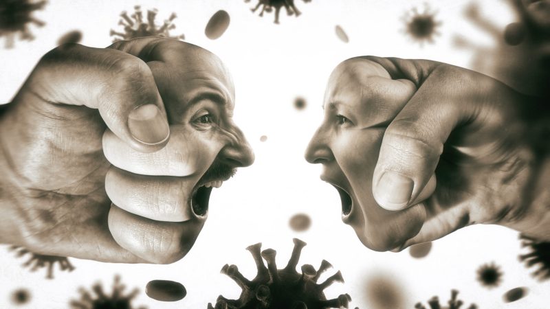 Two,Fists,With,Man's,And,Woman's,Face,Are,Collide,With